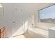 Relaxing bathroom featuring a tub and window at 835 E Marigold Pl, San Tan Valley, AZ 85143