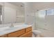 Clean bathroom with shower/tub combo and wood vanity at 835 E Marigold Pl, San Tan Valley, AZ 85143