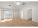 Spacious bedroom with large window and neutral carpeting at 835 E Marigold Pl, San Tan Valley, AZ 85143