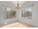 Spacious dining area with large windows and tile floors at 835 E Marigold Pl, San Tan Valley, AZ 85143