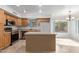 View of kitchen with island, stainless steel appliances, and wood cabinets at 835 E Marigold Pl, San Tan Valley, AZ 85143