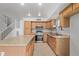 Kitchen with island, stainless steel appliances, and wood cabinets at 835 E Marigold Pl, San Tan Valley, AZ 85143