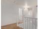 Upstairs hall with carpet and white railings at 835 E Marigold Pl, San Tan Valley, AZ 85143