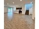 Open concept living room with kitchen and staircase views at 9556 W Sells Dr, Phoenix, AZ 85037