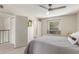 Bright bedroom with ceiling fan, window seat, and ample closet space at 1029 E Lodge Dr, Tempe, AZ 85283