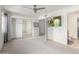 Spacious bedroom with mirrored closet doors and ceiling fan at 1029 E Lodge Dr, Tempe, AZ 85283