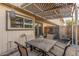 Covered patio with table and chairs, perfect for outdoor dining at 1029 E Lodge Dr, Tempe, AZ 85283
