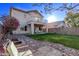 Large backyard with grassy area, fire pit, and patio at 10760 W Monte Vista Rd, Avondale, AZ 85392