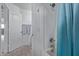 Bathroom with shower/tub combo and blue curtain at 10760 W Monte Vista Rd, Avondale, AZ 85392