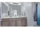 Double vanity bathroom with large mirror at 10760 W Monte Vista Rd, Avondale, AZ 85392