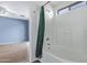 Bathroom with tub shower and bamboo shower curtain at 10760 W Monte Vista Rd, Avondale, AZ 85392