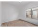 Spacious bedroom featuring a large window and neutral walls at 10760 W Monte Vista Rd, Avondale, AZ 85392