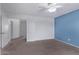 Bedroom with carpet flooring and access to hallway at 10760 W Monte Vista Rd, Avondale, AZ 85392
