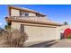 Two-story house with beige walls, tile roof, and a two-car garage at 10760 W Monte Vista Rd, Avondale, AZ 85392