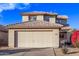 Two-story house with beige walls, tile roof, and a two-car garage at 10760 W Monte Vista Rd, Avondale, AZ 85392