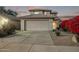 Two-story house with attached garage, landscaping, and a paved driveway at 10760 W Monte Vista Rd, Avondale, AZ 85392