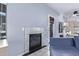 Living room with a gas fireplace and access to backyard at 10760 W Monte Vista Rd, Avondale, AZ 85392