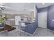 Kitchen features light wood cabinets, a breakfast bar, and tile flooring at 10760 W Monte Vista Rd, Avondale, AZ 85392