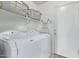 Laundry room with washer, dryer, and shelving at 10760 W Monte Vista Rd, Avondale, AZ 85392