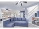 Open living room and kitchen with a sectional sofa and breakfast bar at 10760 W Monte Vista Rd, Avondale, AZ 85392