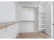 Walk-in closet with shelving and hanging rods at 10760 W Monte Vista Rd, Avondale, AZ 85392