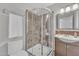 Clean bathroom with shower, marble tile, and wood vanity at 10769 N 113Th St, Scottsdale, AZ 85259