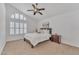 Relaxing bedroom with neutral decor, ample natural light, and a ceiling fan at 10769 N 113Th St, Scottsdale, AZ 85259