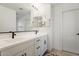 Modern bathroom with double vanity and large mirror at 10994 W Mckinley St, Avondale, AZ 85323