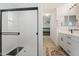Bathroom with shower and double vanity at 10994 W Mckinley St, Avondale, AZ 85323