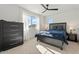 Bedroom with large bed, dresser, and window at 10994 W Mckinley St, Avondale, AZ 85323