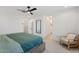 Main bedroom with large bed and sitting area at 10994 W Mckinley St, Avondale, AZ 85323