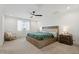 Main bedroom with large bed and window at 10994 W Mckinley St, Avondale, AZ 85323