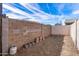 Backyard with block wall and storage space at 11668 W Cholla Ct, Surprise, AZ 85378