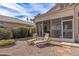 Relaxing patio with lounge chairs and screened enclosure at 11668 W Cholla Ct, Surprise, AZ 85378