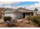 Charming one-story house with a two-car garage and desert landscaping at 1420 S 120Th Dr, Avondale, AZ 85323