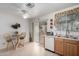 Kitchen with light wood cabinets, breakfast nook, and sliding door at 1420 S 120Th Dr, Avondale, AZ 85323