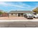 Single story home with a gray Ford truck and silver car in the driveway at 1424 S Temple Cir, Mesa, AZ 85204