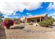 House exterior with desert landscaping and a covered patio at 15253 W Pasadena Dr, Surprise, AZ 85374