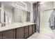 Double vanity bathroom with a large walk-in shower at 15253 W Pasadena Dr, Surprise, AZ 85374