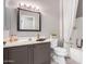 Clean bathroom with a single sink vanity and shower/tub combo at 15253 W Pasadena Dr, Surprise, AZ 85374
