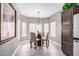 Bright breakfast nook with glass-top table and built-in seating at 15253 W Pasadena Dr, Surprise, AZ 85374