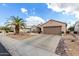 Single-story home with desert landscaping and two-car garage at 15253 W Pasadena Dr, Surprise, AZ 85374