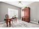 Bright home office features built-in cabinetry and hardwood floors at 15253 W Pasadena Dr, Surprise, AZ 85374