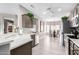 Bright kitchen boasts modern cabinets and breakfast nook at 15253 W Pasadena Dr, Surprise, AZ 85374