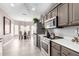 Open kitchen with stainless steel appliances and breakfast area at 15253 W Pasadena Dr, Surprise, AZ 85374