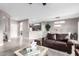 Open concept living area with comfortable seating and kitchen views at 15253 W Pasadena Dr, Surprise, AZ 85374