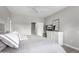King-size bed in main bedroom with dresser and TV at 15253 W Pasadena Dr, Surprise, AZ 85374