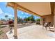 Covered patio with seating area, perfect for outdoor relaxation at 15253 W Pasadena Dr, Surprise, AZ 85374