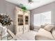 Cozy sitting area with built-in shelving and chaise lounge at 15253 W Pasadena Dr, Surprise, AZ 85374