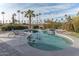 Inviting kidney-shaped pool with spa and lounge chairs, surrounded by lush landscaping at 15538 W Whitton Ave, Goodyear, AZ 85395